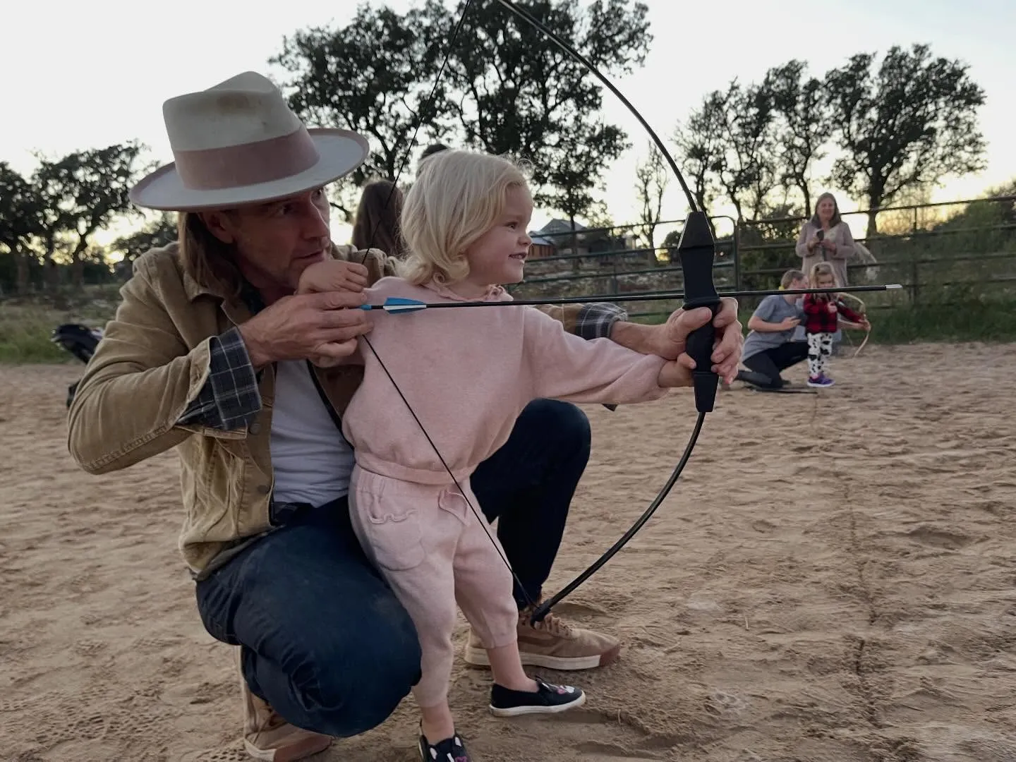 James Van Der Beek teaching his daughter archery.