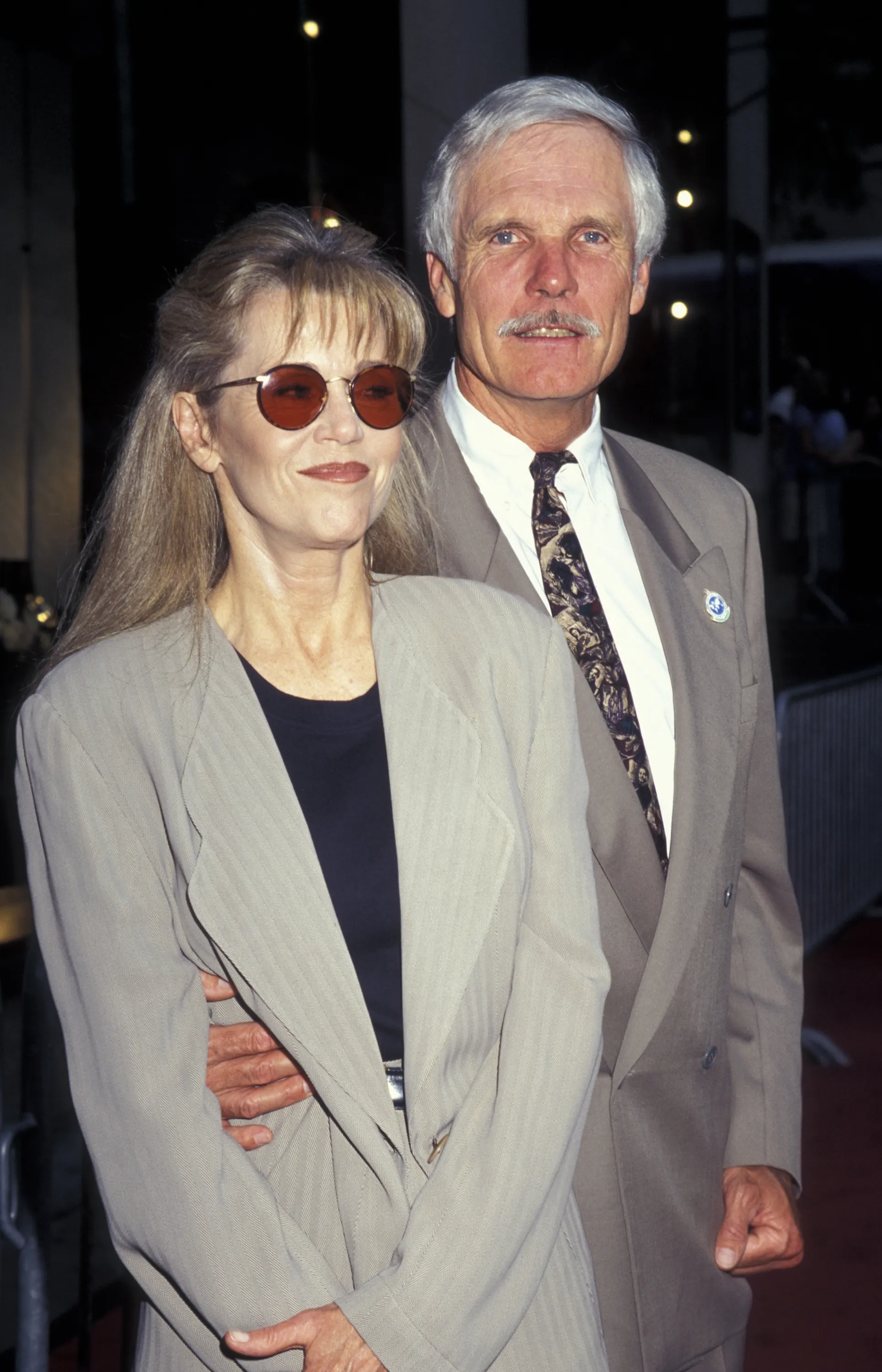 Jane Fonda and Ted Turner standing side-by-side.
