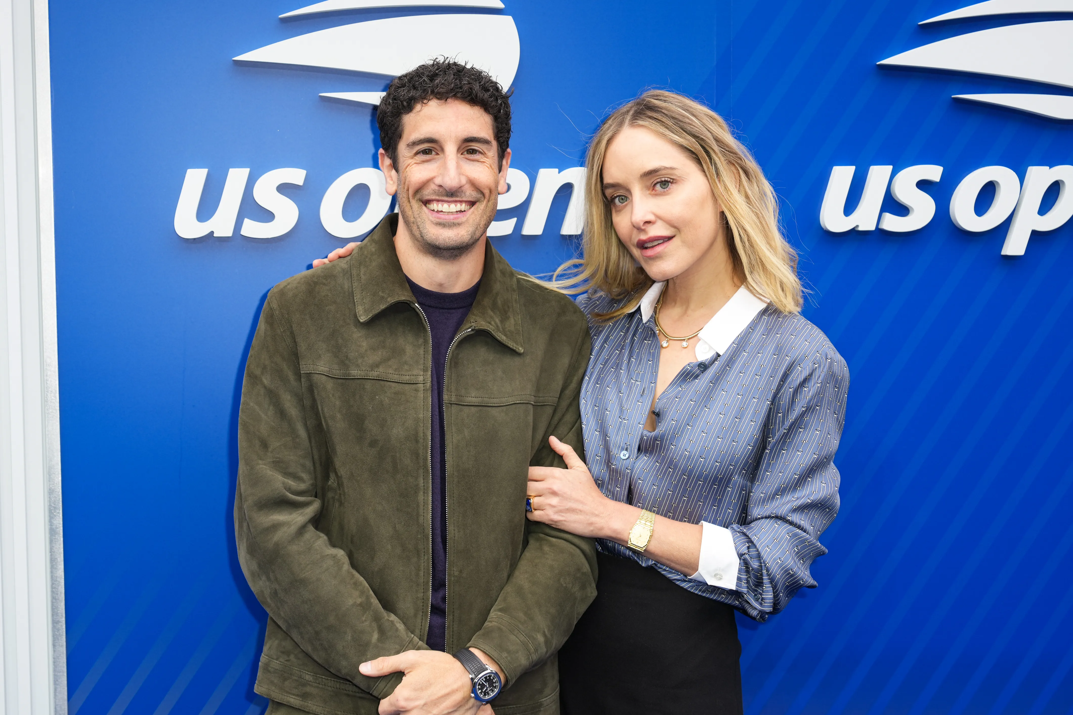 Jason Biggs and Jenny Mollen pose at the US Open Tennis Championship.
