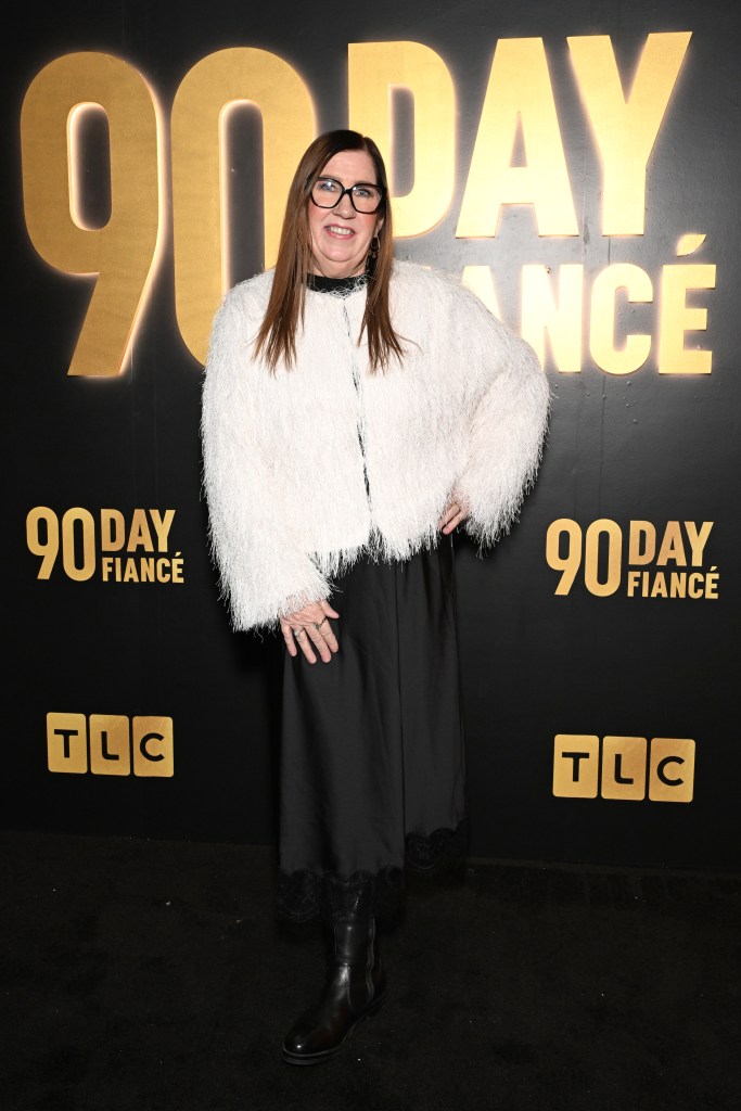 Jenny Slatten in a white fluffy jacket and black dress at TLC's 90 Day Fiancé Holiday Event.