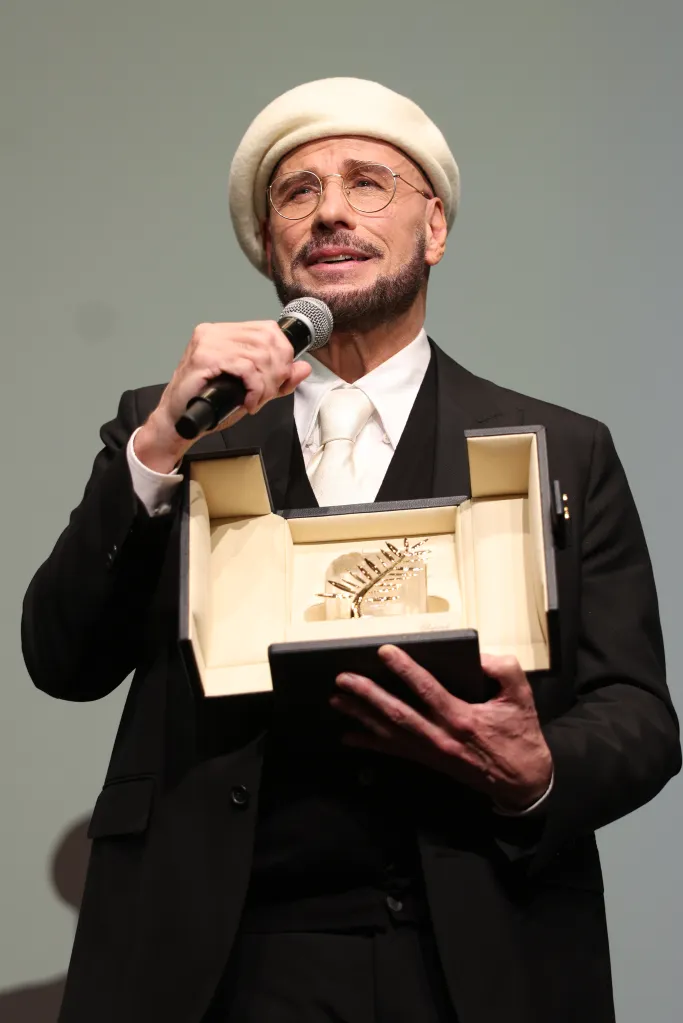 John Travolta accepting the Honorary Palme Award at the 79th annual Cannes Film Festival.