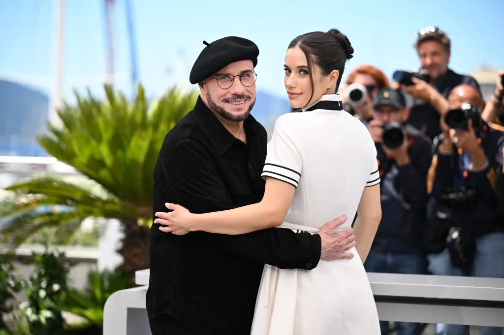 John Travolta and Ella Bleu Travolta posing at the 