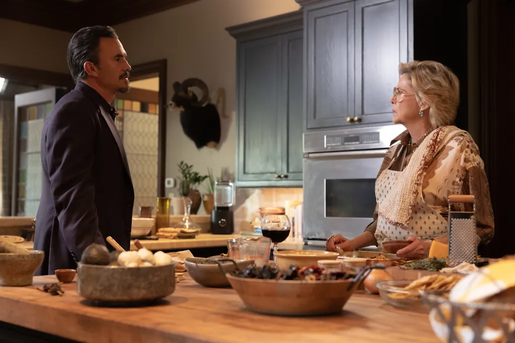 Joaquin and Beulah Jackson in a kitchen with a table full of food items.
