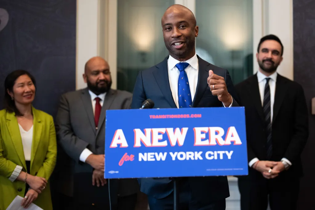 Kamar Samuels speaking at a podium with