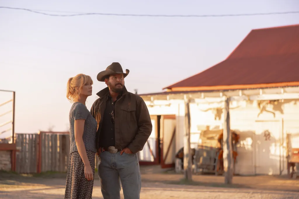 Kelly Reilly as Beth Dutton and Cole Hauser as Rip Wheeler look towards the right.
