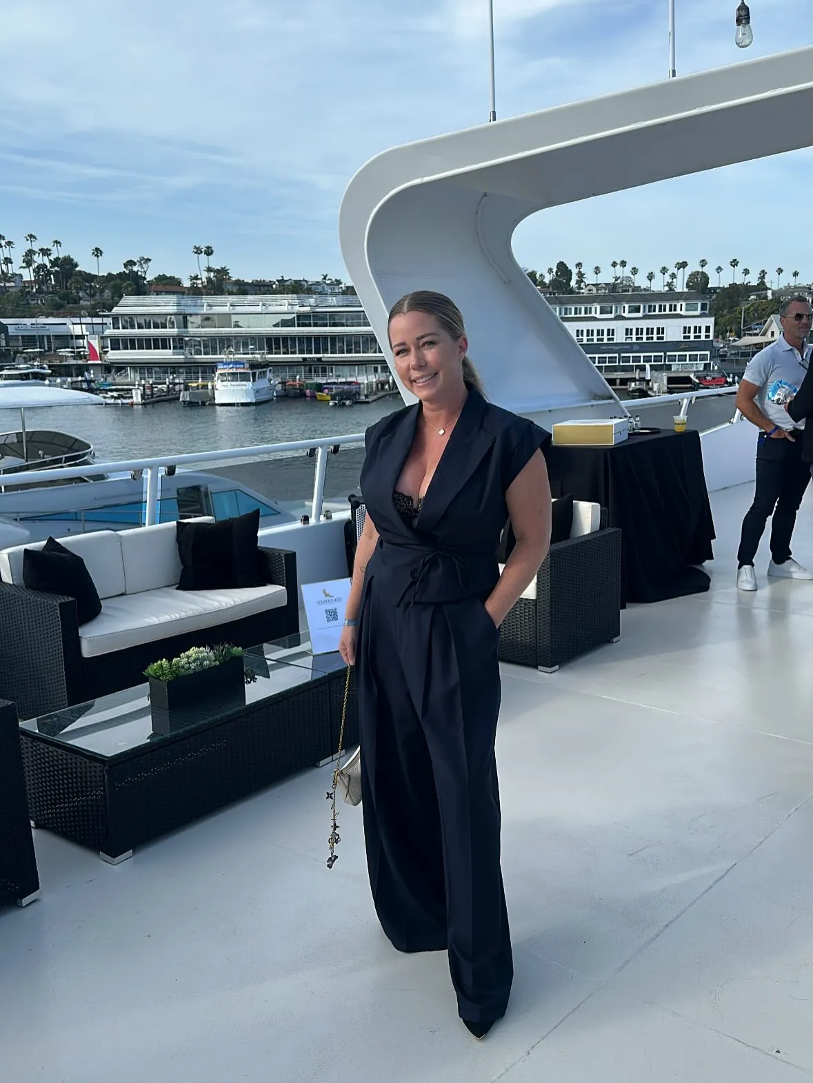 Kendra Wilkinson posing on a yacht.