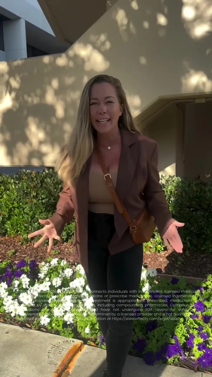Kendra Wilkinson smiling at the camera.