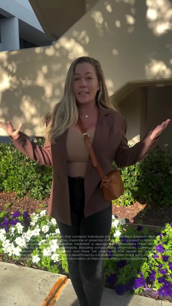 Kendra Wilkinson with her arms raised, standing in front of a flowerbed and building, with text about a medical platform.