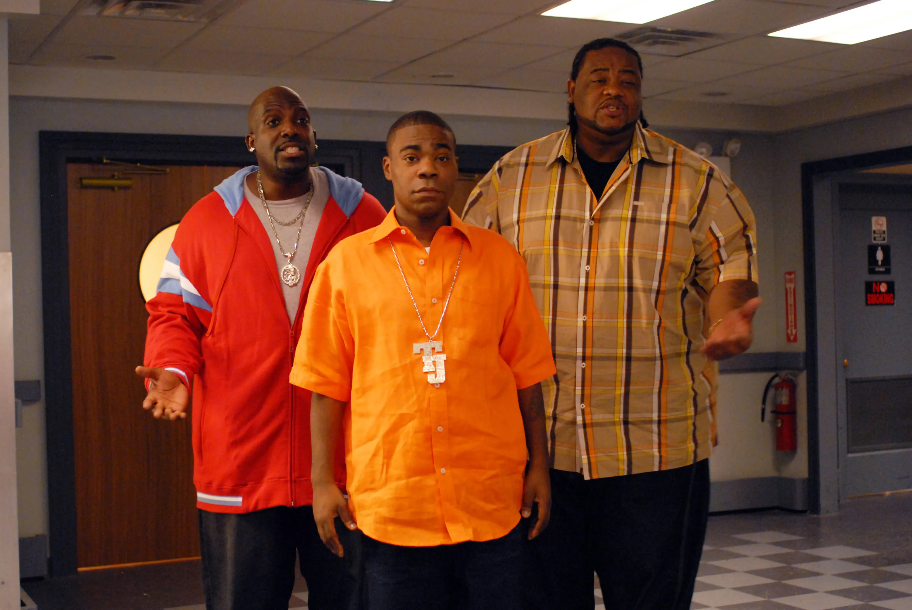 Kevin Brown, Tracy Morgan, and Grizz Chapman standing together.