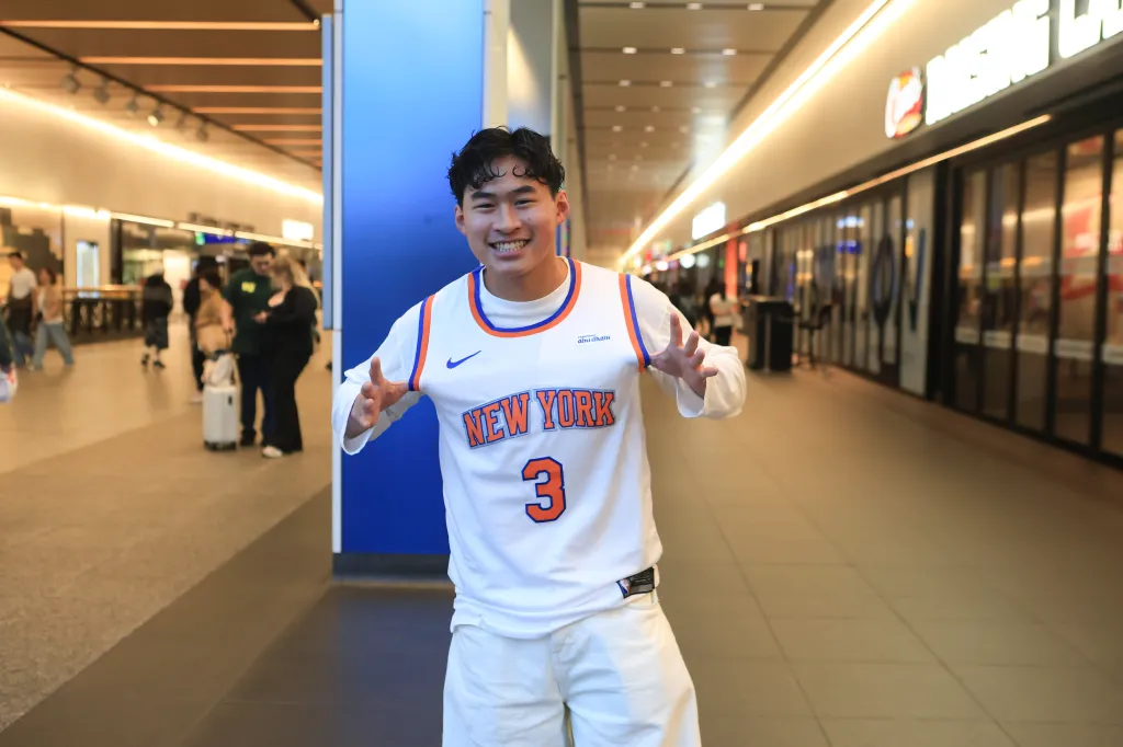 Knicks fan Khoa Nguyen in Penn Station, Manhattan.
