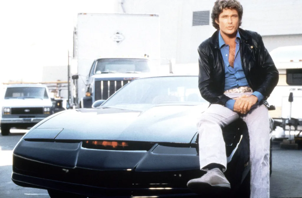 David Hasselhoff as Michael Knight sitting on K.I.T.T. the Pontiac Firebird.