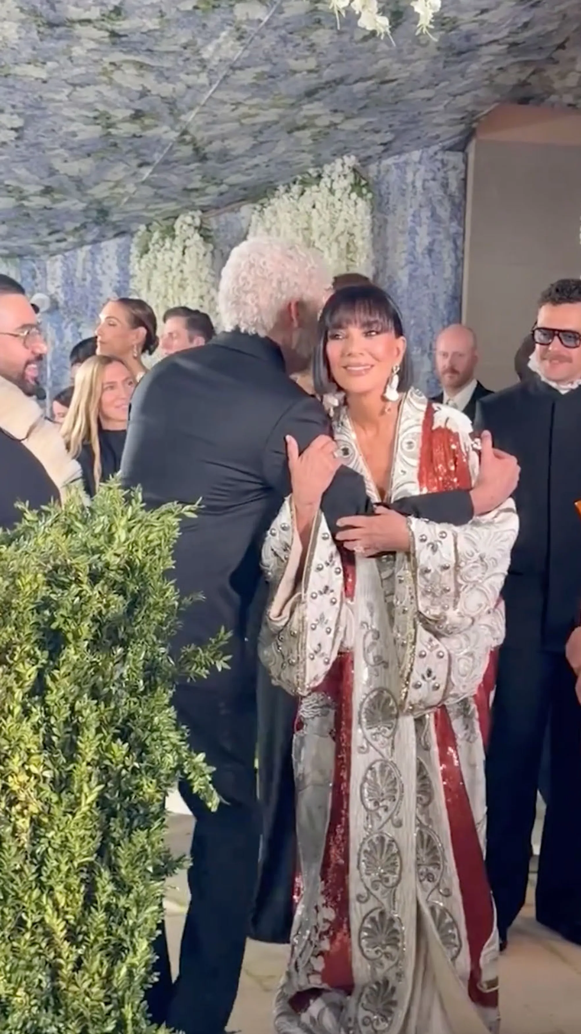Kris Jenner smiles while embracing Bad Bunny at the Met Gala.