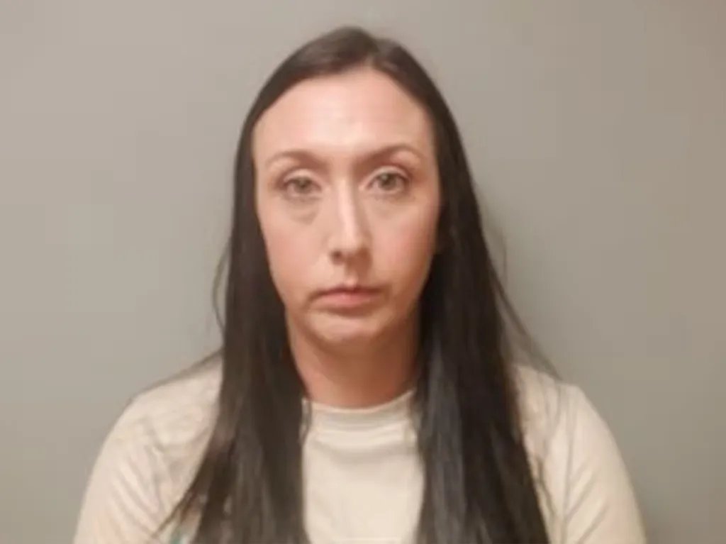 Mugshot of Kristin Bell, an employee arrested in connection to a child abuse incident.