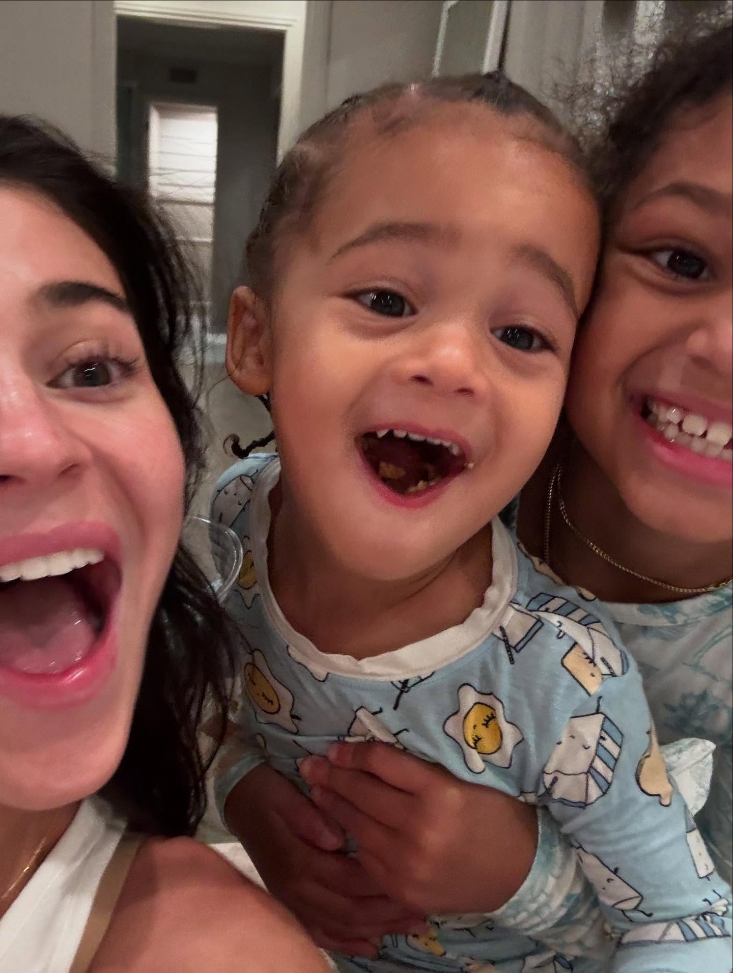 Kylie Jenner and her son Aire smiling.