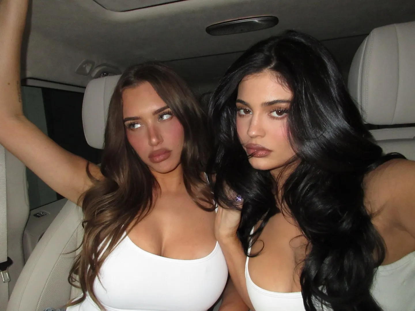 Kylie Jenner and Anastasia Karanikolaou posing in a car.