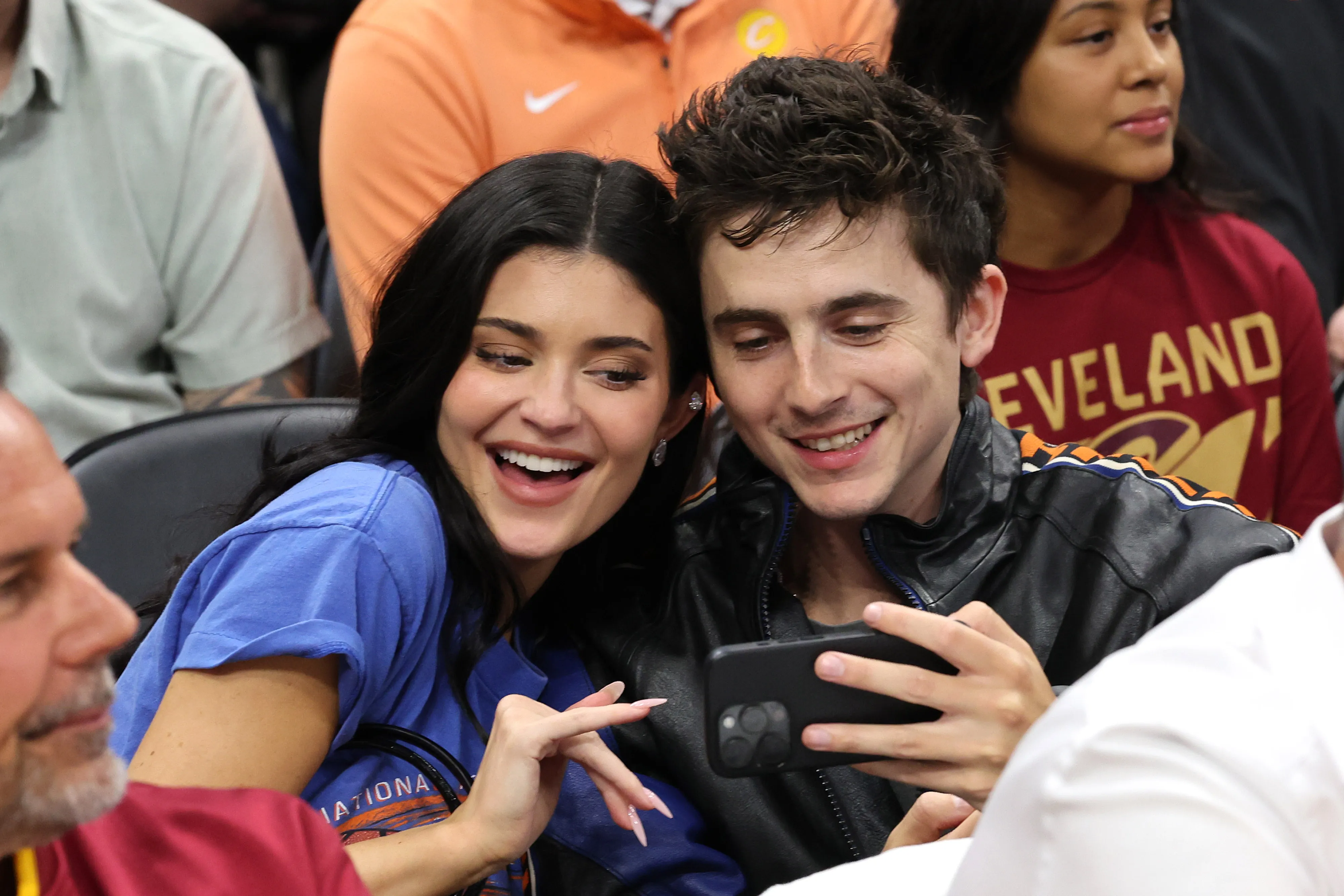 Kylie Jenner taking a selfie with Timothée Chalamet at an NBA game.