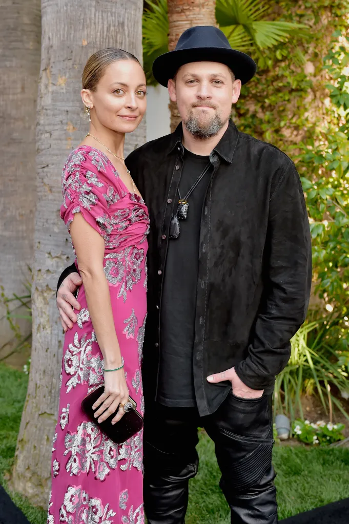 Nicole Richie and Joel Madden pose for a picture.