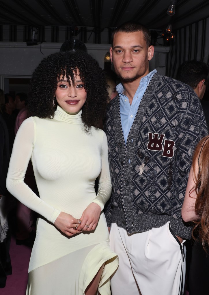 Chase Infiniti in a light yellow dress and Tyriq Withers in a blue shirt and patterned cardigan.