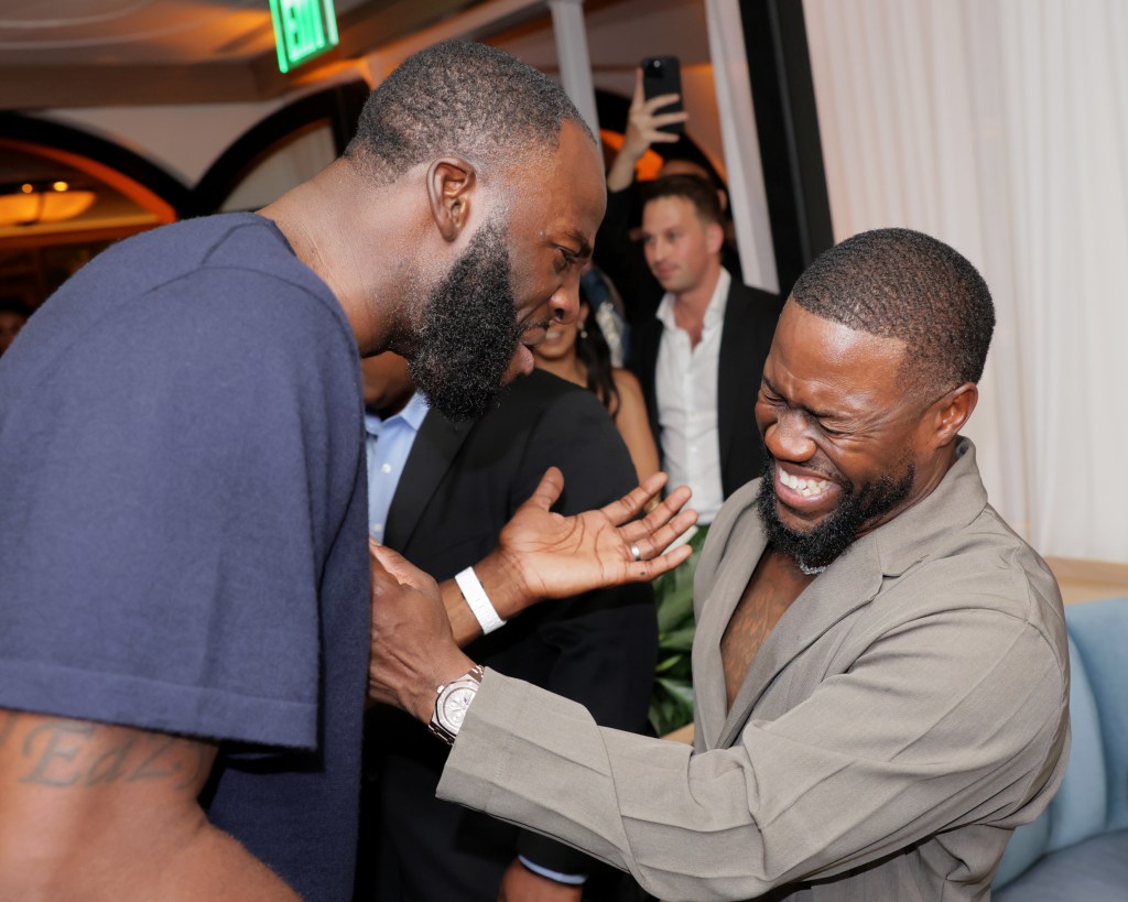 Draymond Green and Kevin Hart laughing at the Sports Illustrated Race Weekend Kickoff.