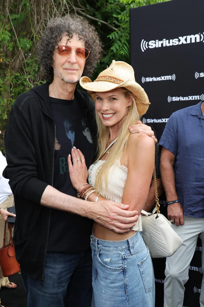 Howard Stern and Beth Stern pose together at a SiriusXM event.