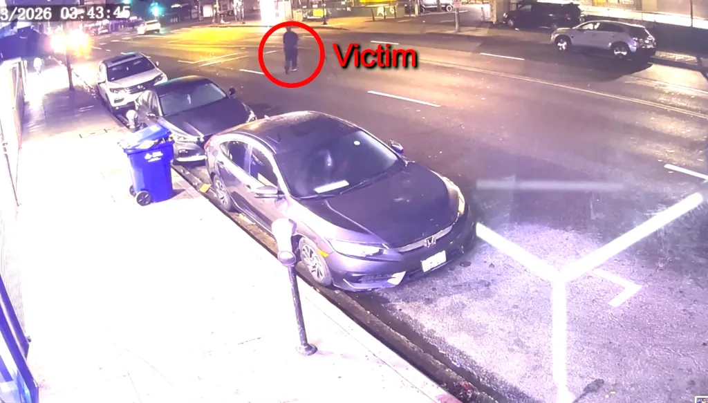 Surveillance footage showing a pedestrian, labeled 
