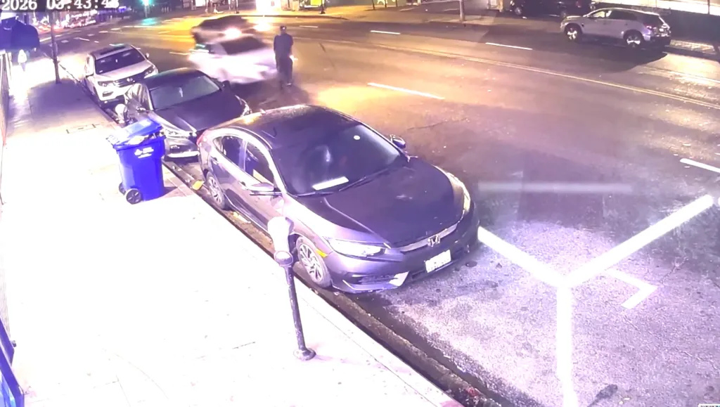 Surveillance footage capturing a fatal hit-and-run on a city street at night.