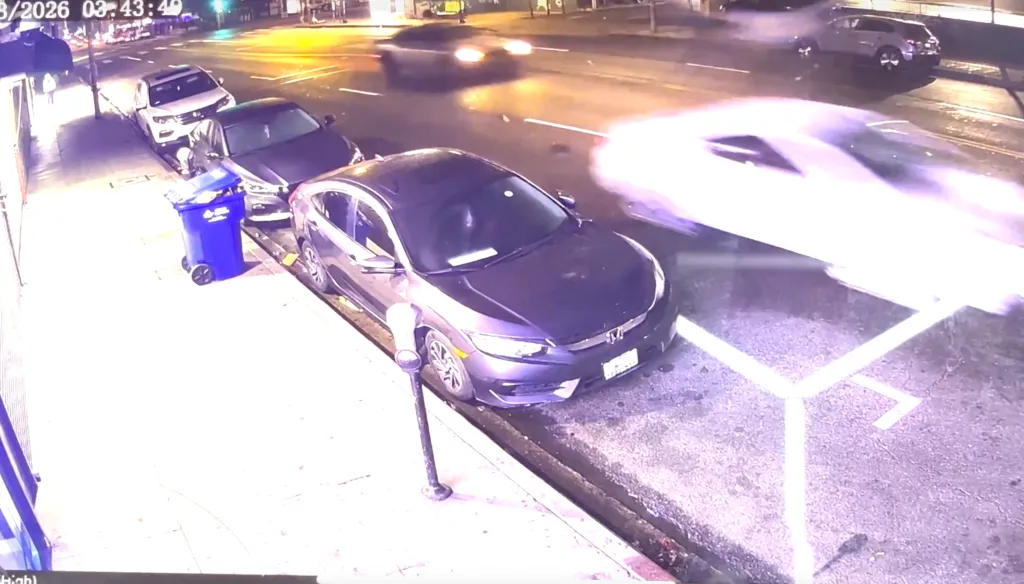 Surveillance video of a fatal hit-and-run, showing a white vehicle speeding down a street at night.