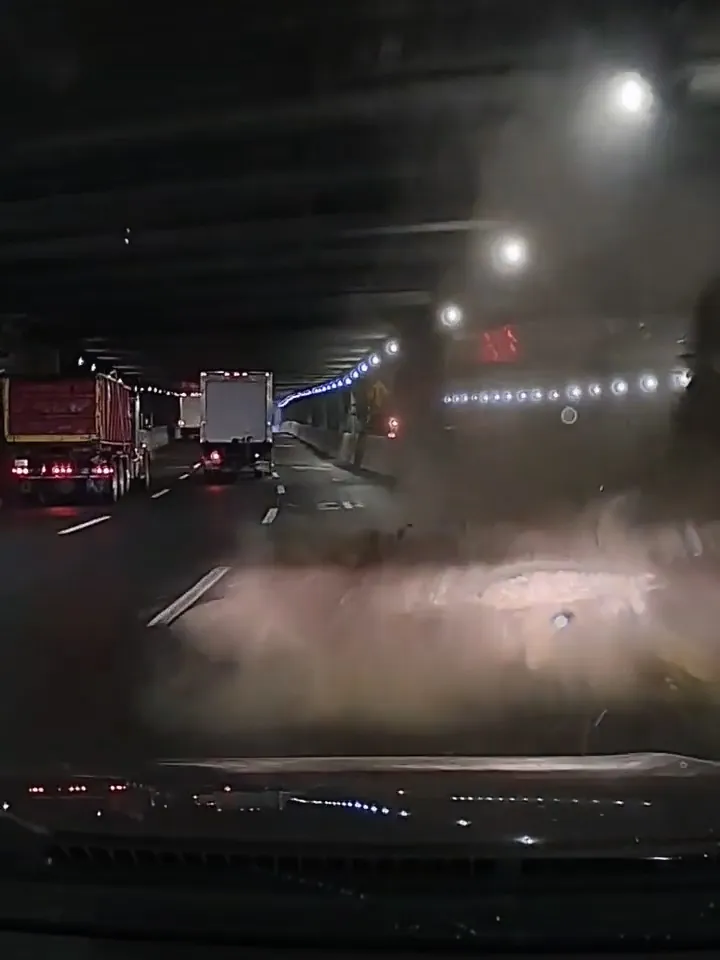 Debris falling from the ceiling of a dark tunnel on the Trans-Manhattan Expressway.