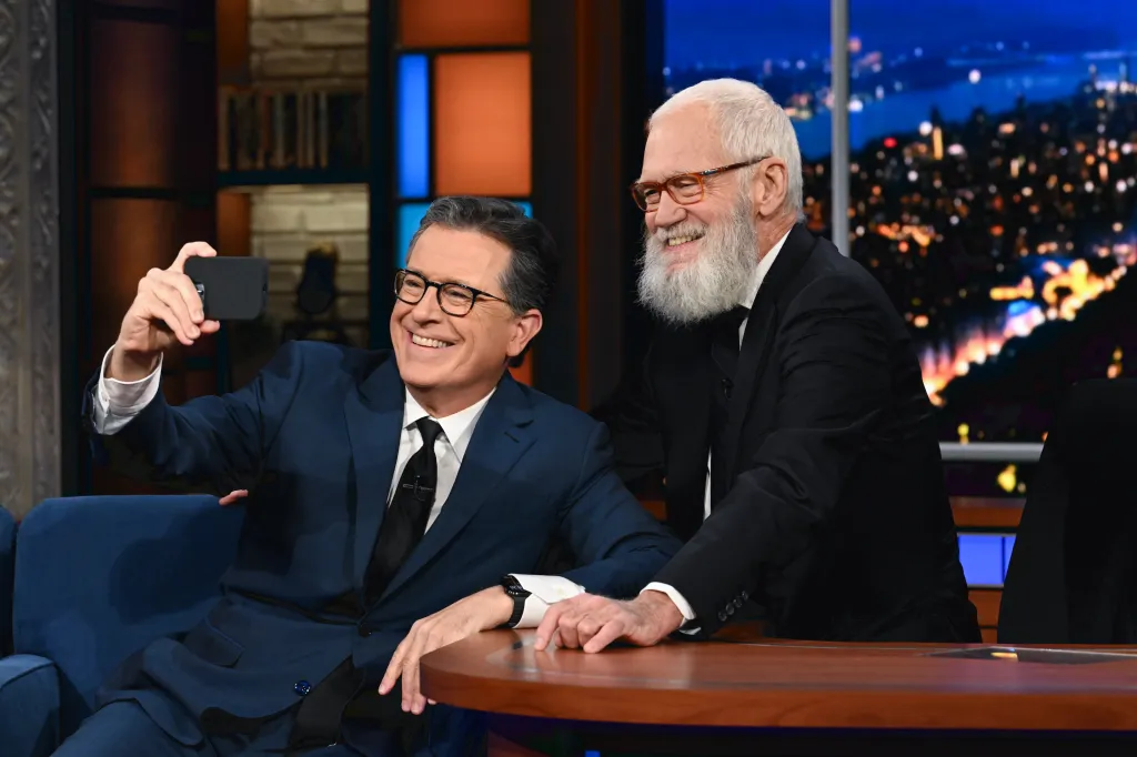 Stephen Colbert takes a selfie with David Letterman on 