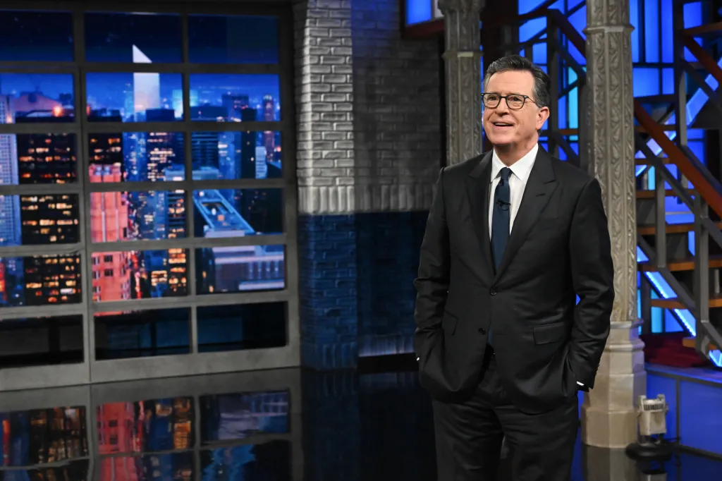 Stephen Colbert standing on the set of The Late Show with Stephen Colbert.