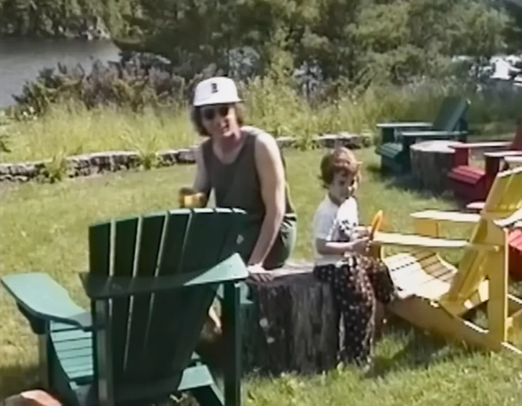 Martin Short with a child in an outdoor setting.