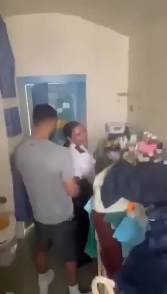 Linda De Sousa Abreu in uniform with Linton Weirich in a prison cell.