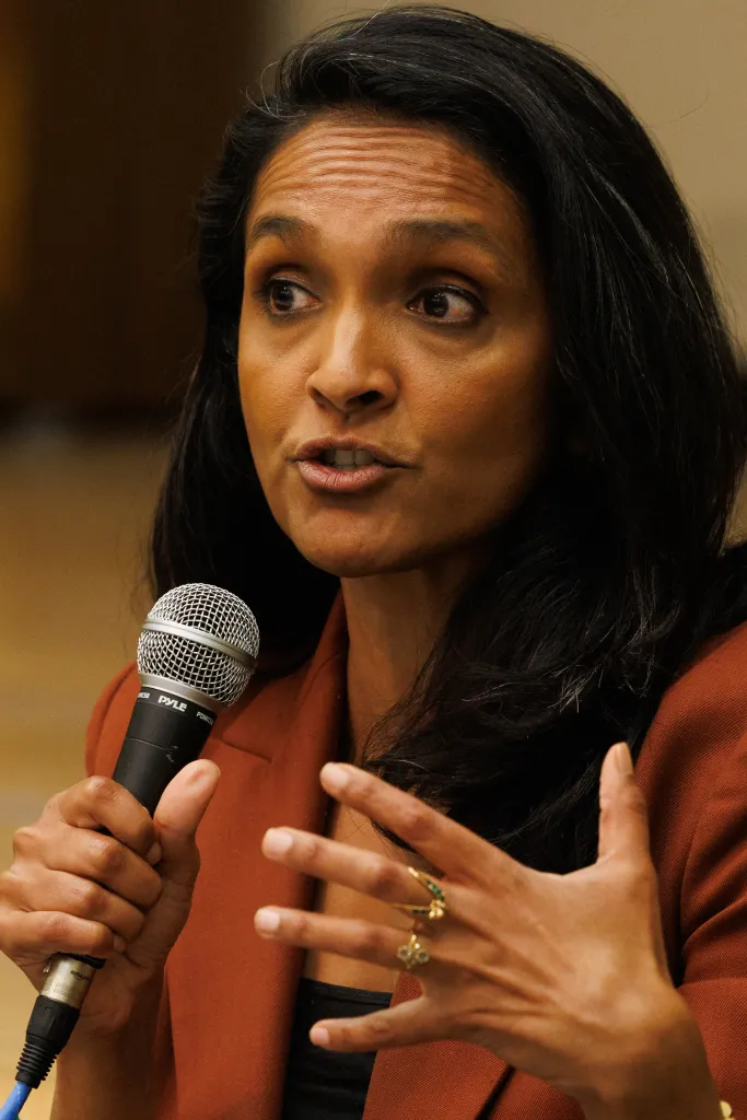 Los Angeles City Council member and mayoral candidate Nithya Raman speaking into a microphone.