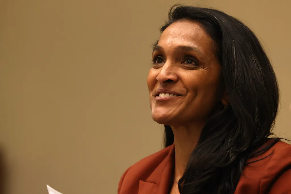 Los Angeles City Council member Nithya Raman smiling while looking up.