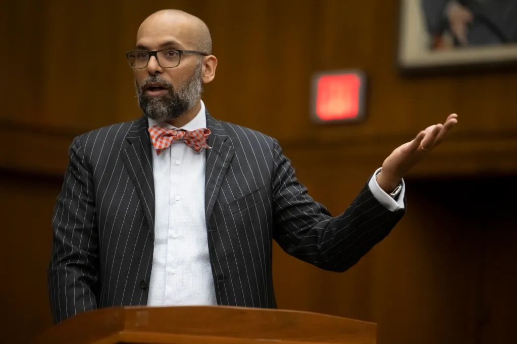 Magistrate Judge Zia M. Faruqui speaking at a debate.