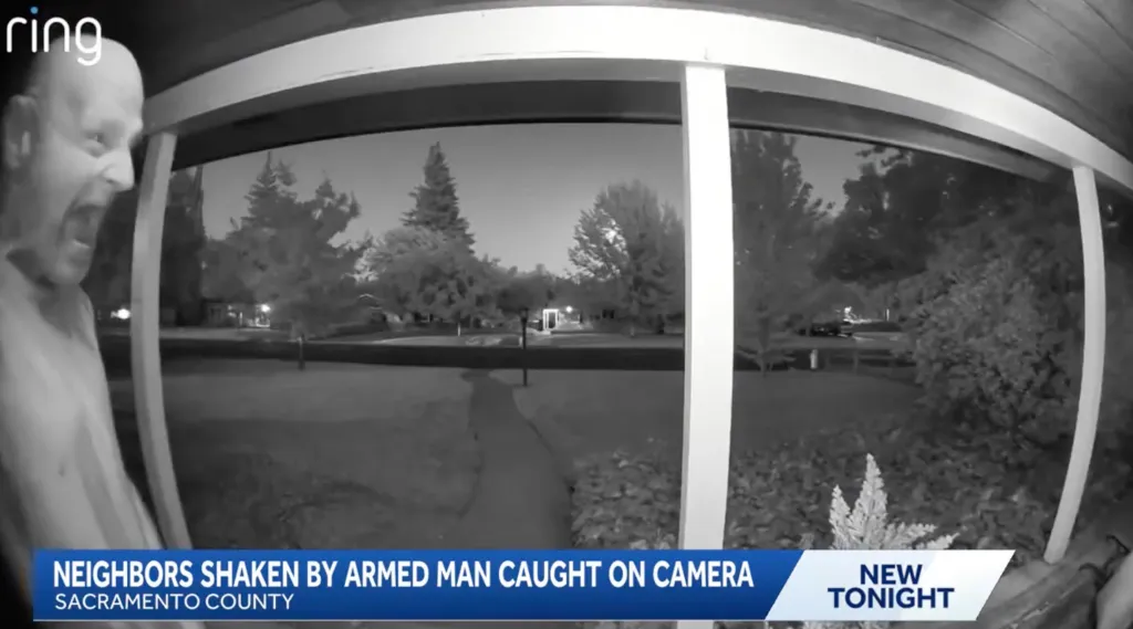 Ring doorbell footage of a man at night holding a knife and yelling, with the text 