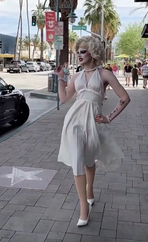 A Marilyn Monroe impersonator in Palm Springs, California, poses in a white halter dress.