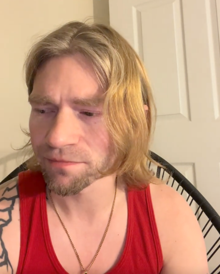 Matt Brown wearing a red tank top.