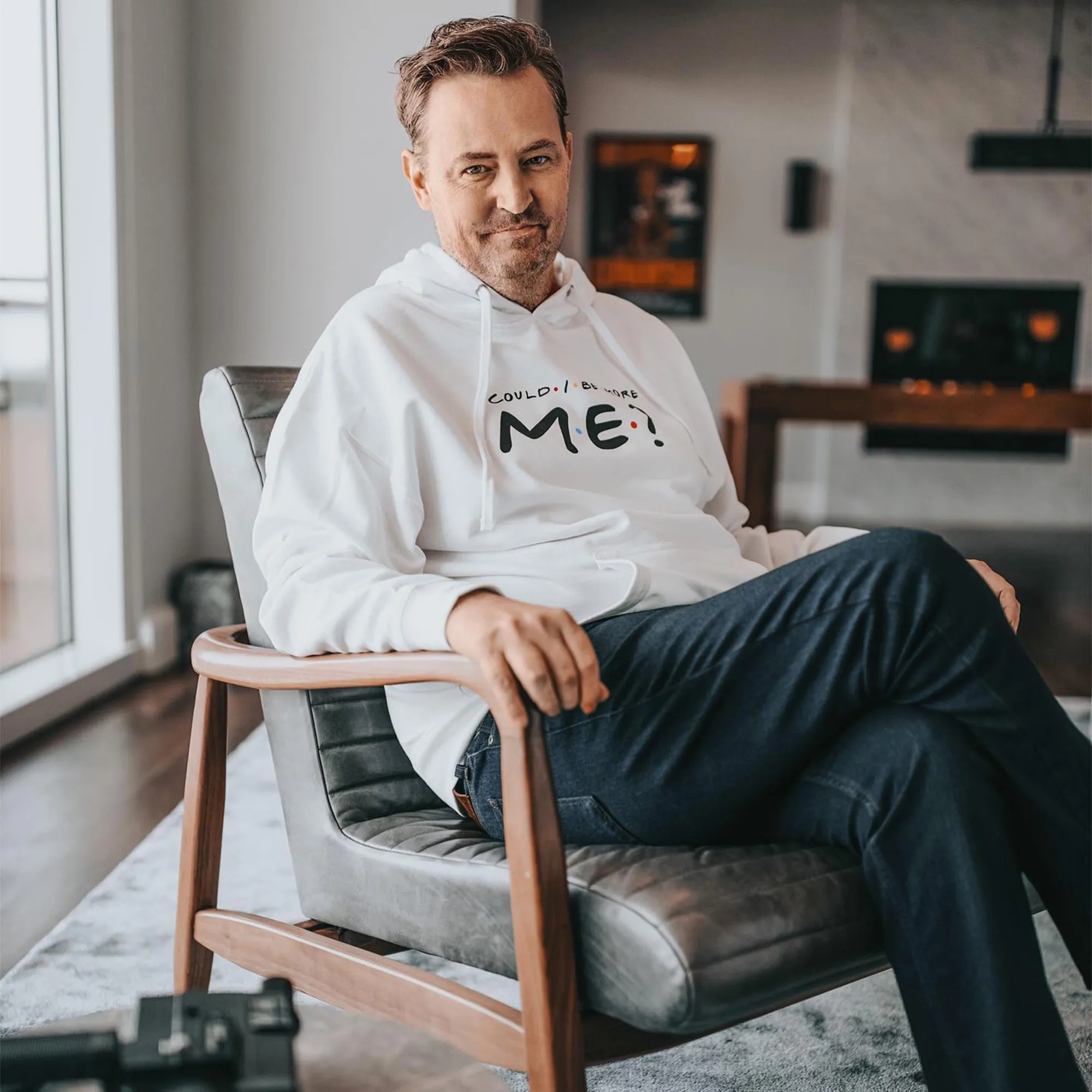 Matthew Perry wearing a white hoodie with 