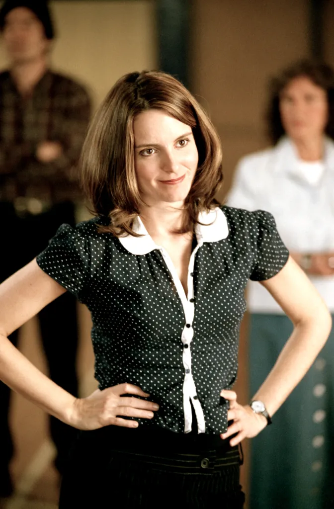 Tina Fey in a black polka dot shirt, hands on hips, from the movie Mean Girls.