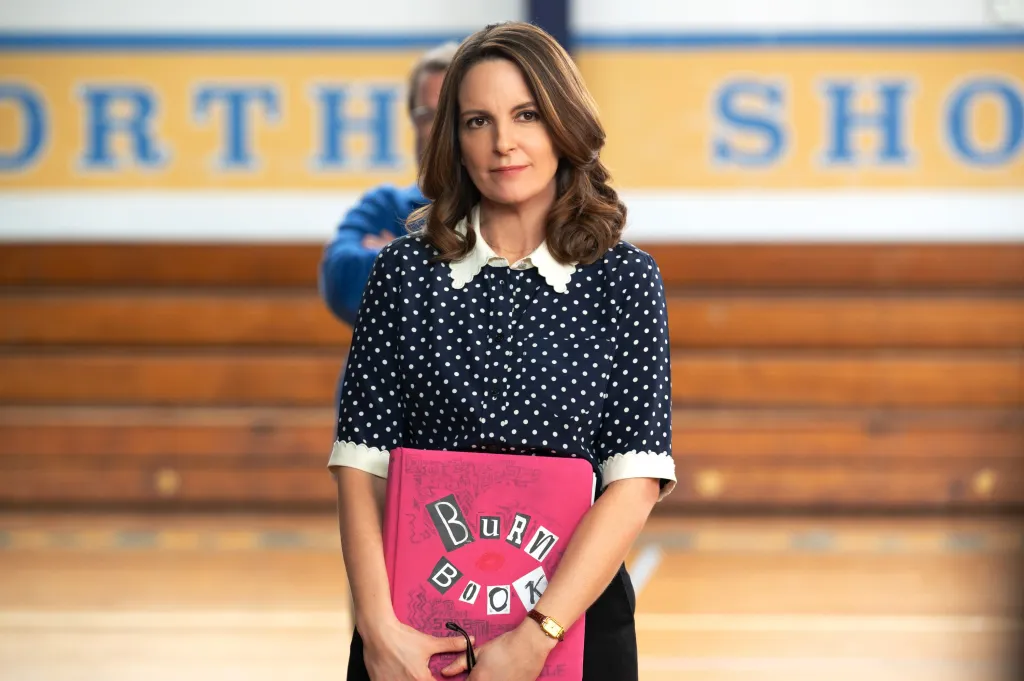 Tina Fey as Ms. Norbury holding the Burn Book in Mean Girls.