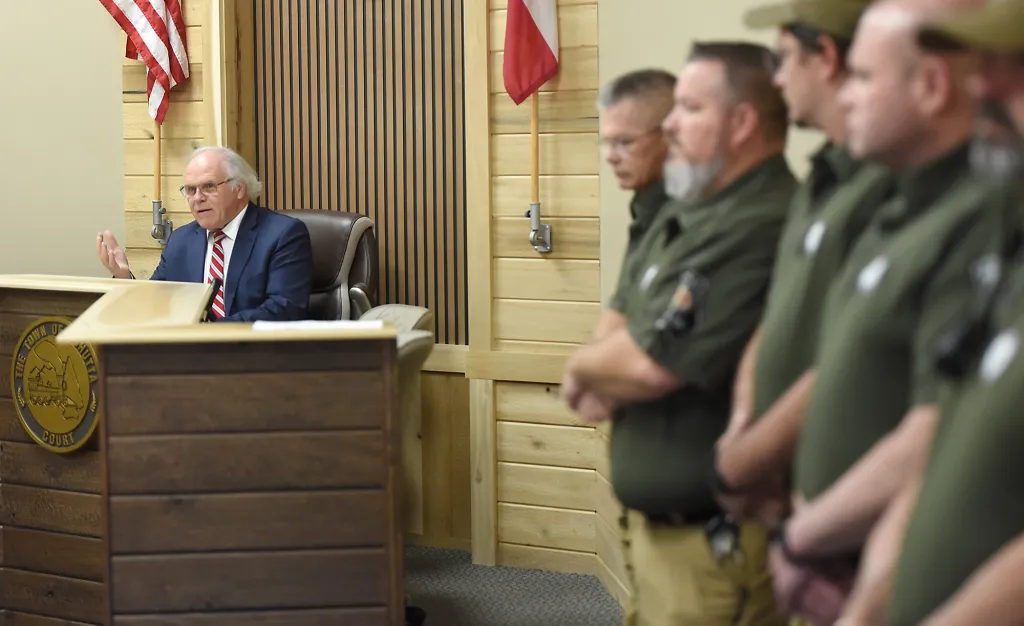 The town’s attorney, Bryan Rayburn, told the council the officers’ firings hadn’t followed the town charter, which requires 30 days’ notice be given before employees can be suspended or removed.