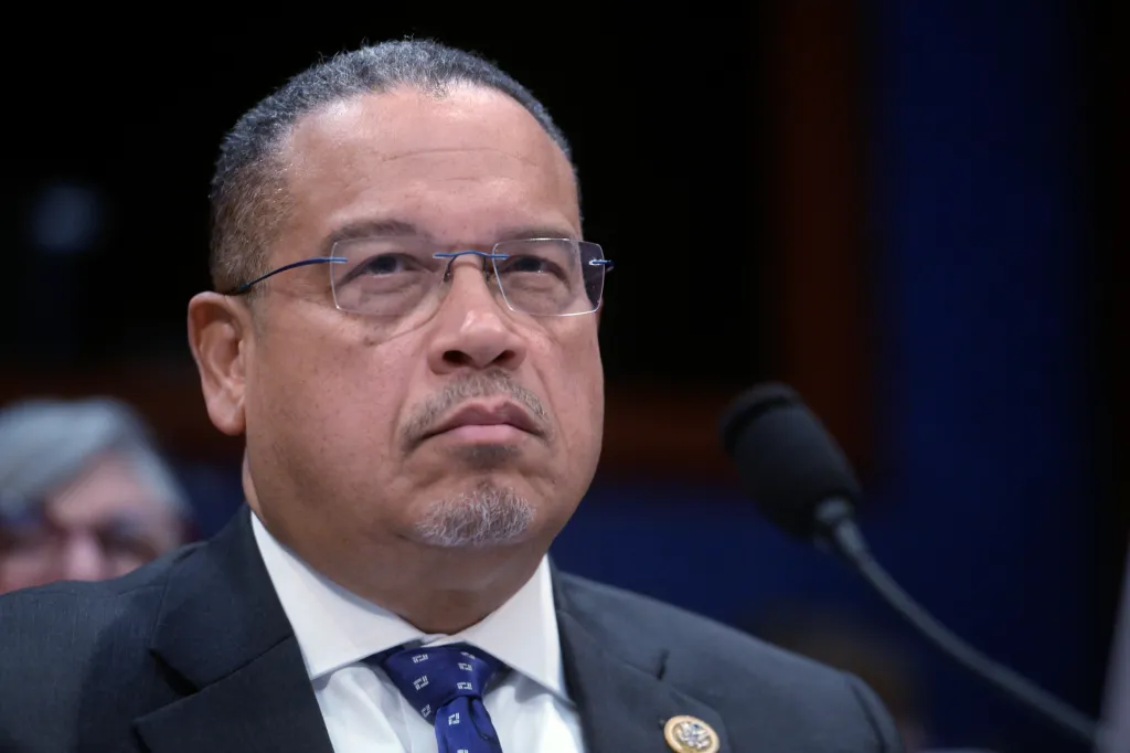 Minnesota Attorney General Keith Ellison listening intently during a hearing.