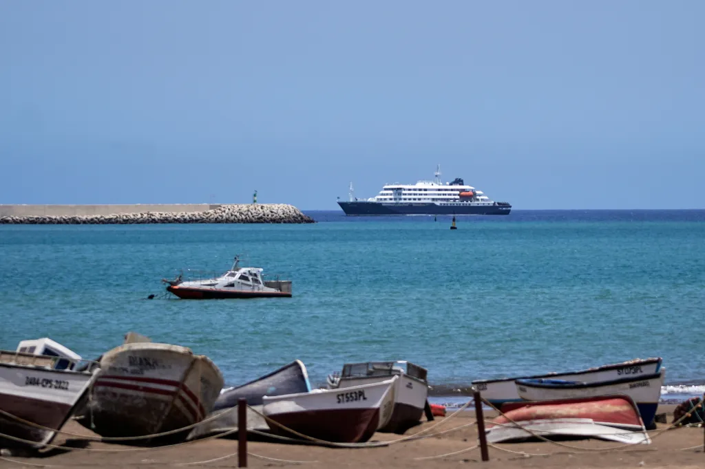 MV Hondius cruise ship anchored at a port in Praia, Cape Verde.
