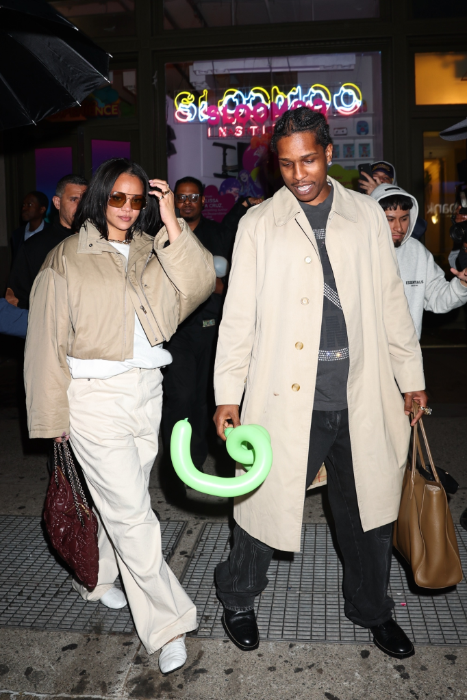 Rihanna and A$AP Rocky leave RZA's birthday party in NYC, with A$AP Rocky holding a green balloon.