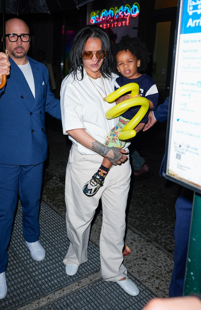 Rihanna holding son RZA at Sloomoo Institute.