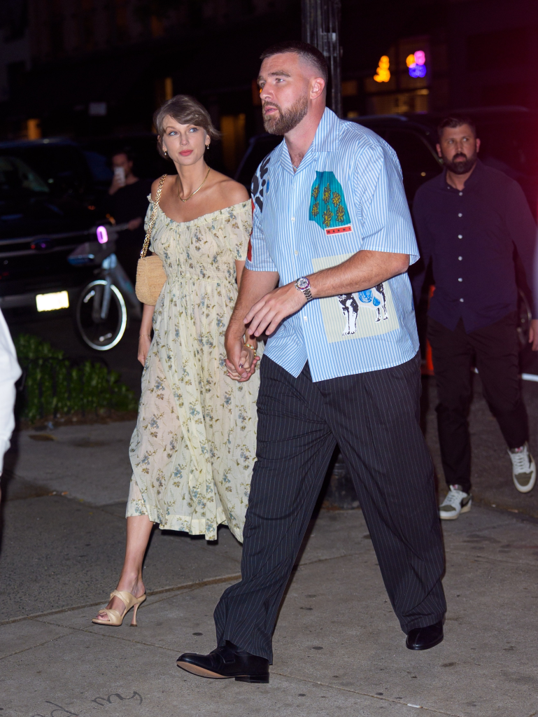 Taylor Swift and Travis Kelce holding hands while arriving at Or’esh restaurant in New York City.