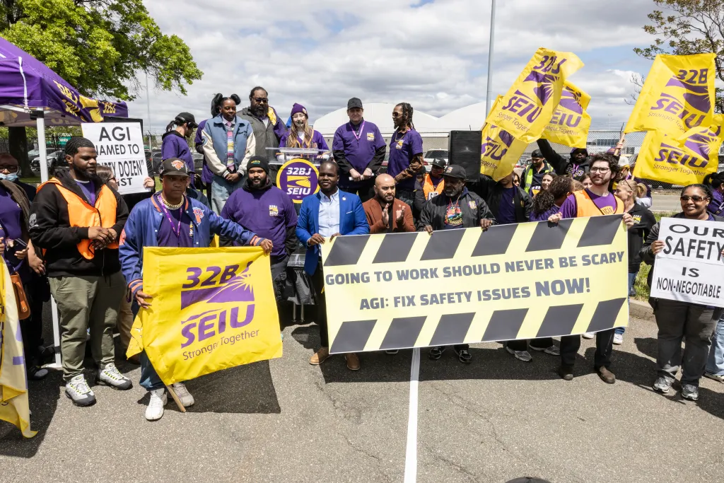 Workers rally at JFK.