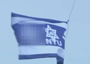 Swastika flag raised above NYU building named after billionaire Jewish causes donor during graduation week