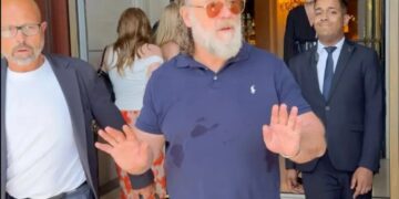 Russell Crowe warns autograph hunters gathered outside his Paris hotel: ‘Don’t f–king push in on me’